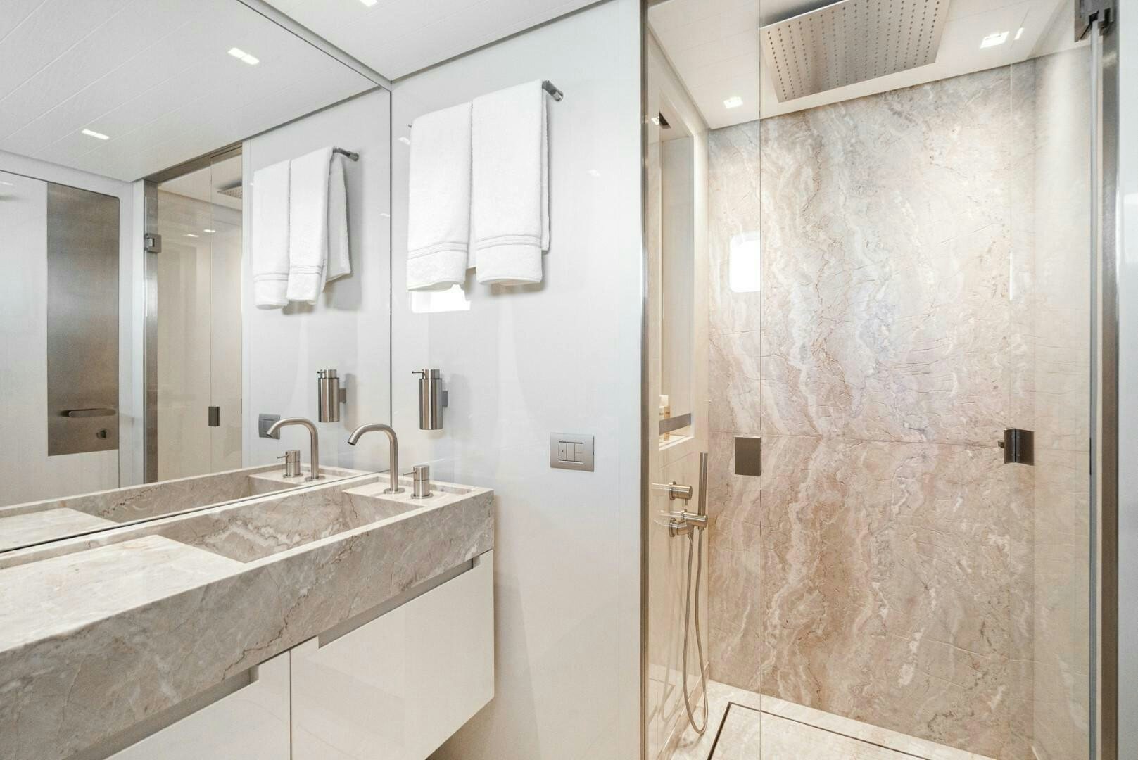 a bathroom with a sink and a mirror aboard GENOA Yacht for Sale