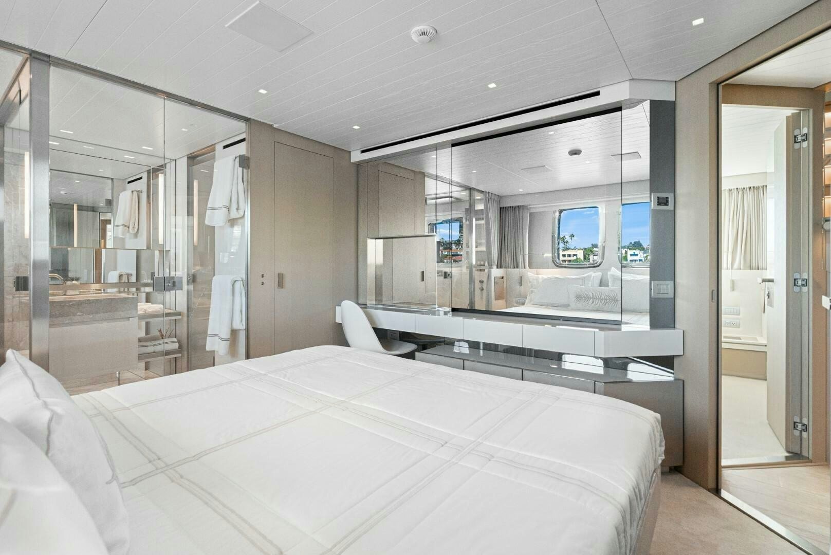 a large hotel room with a large bed aboard GENOA Yacht for Sale