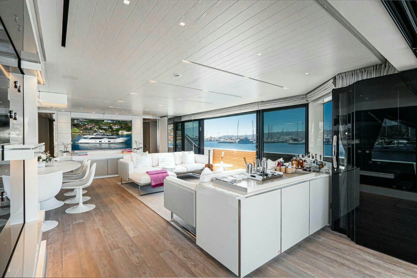 a modern kitchen with white cabinets aboard GENOA Yacht for Sale