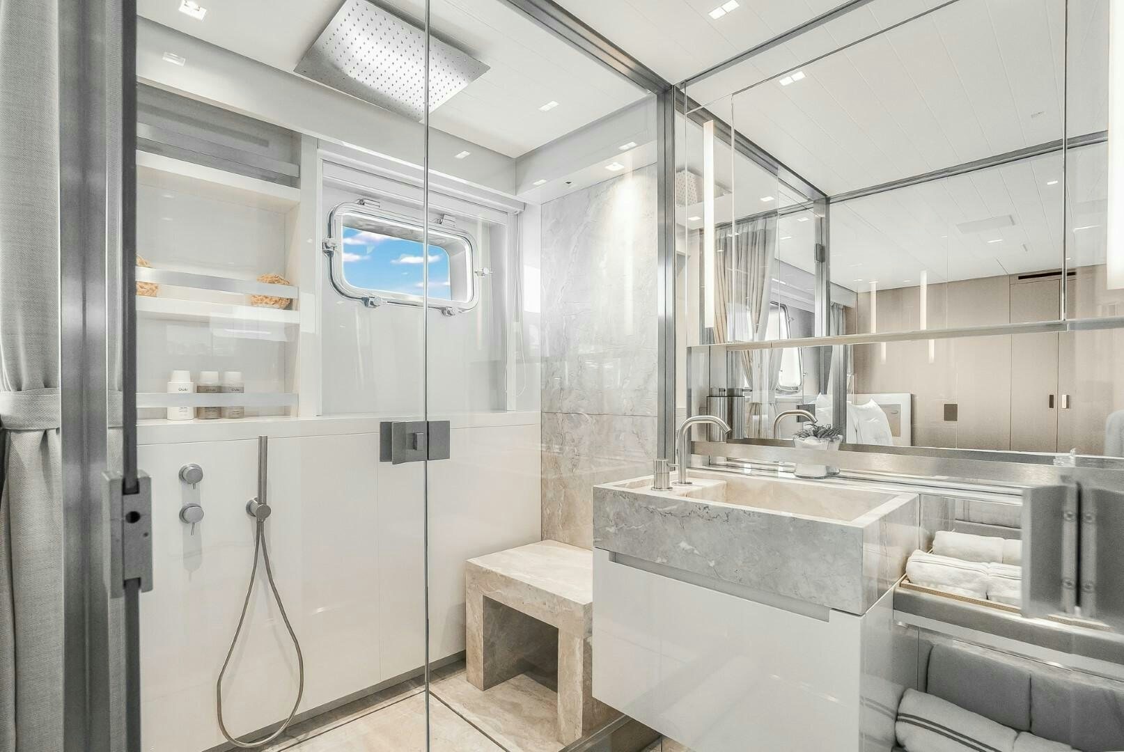 a bathroom with a sink and a mirror aboard GENOA Yacht for Sale