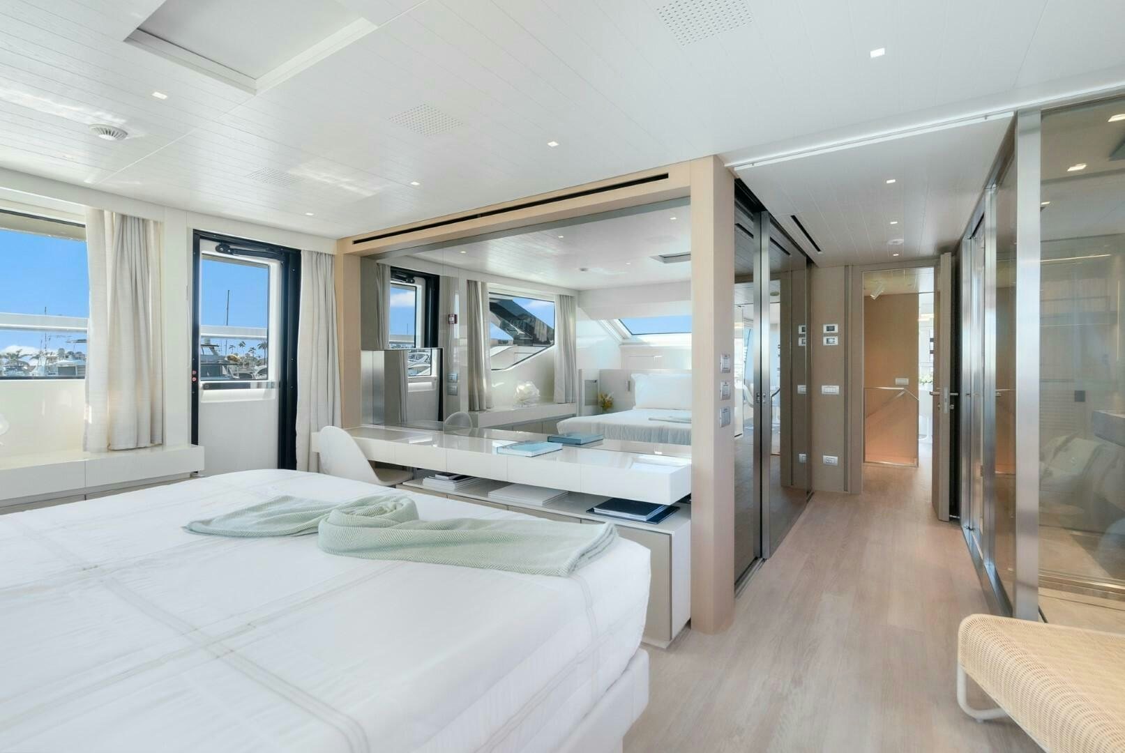 a room with a bed and a large window aboard GENOA Yacht for Sale