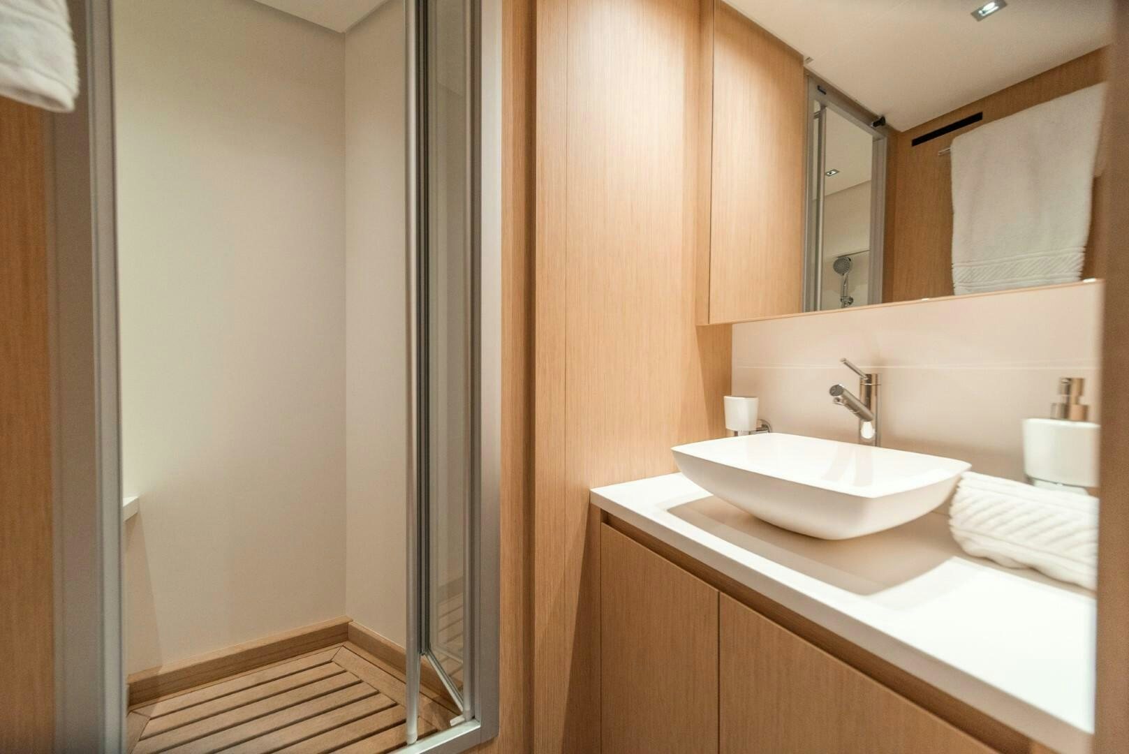 a bathroom with a sink and a mirror aboard GENOA Yacht for Sale