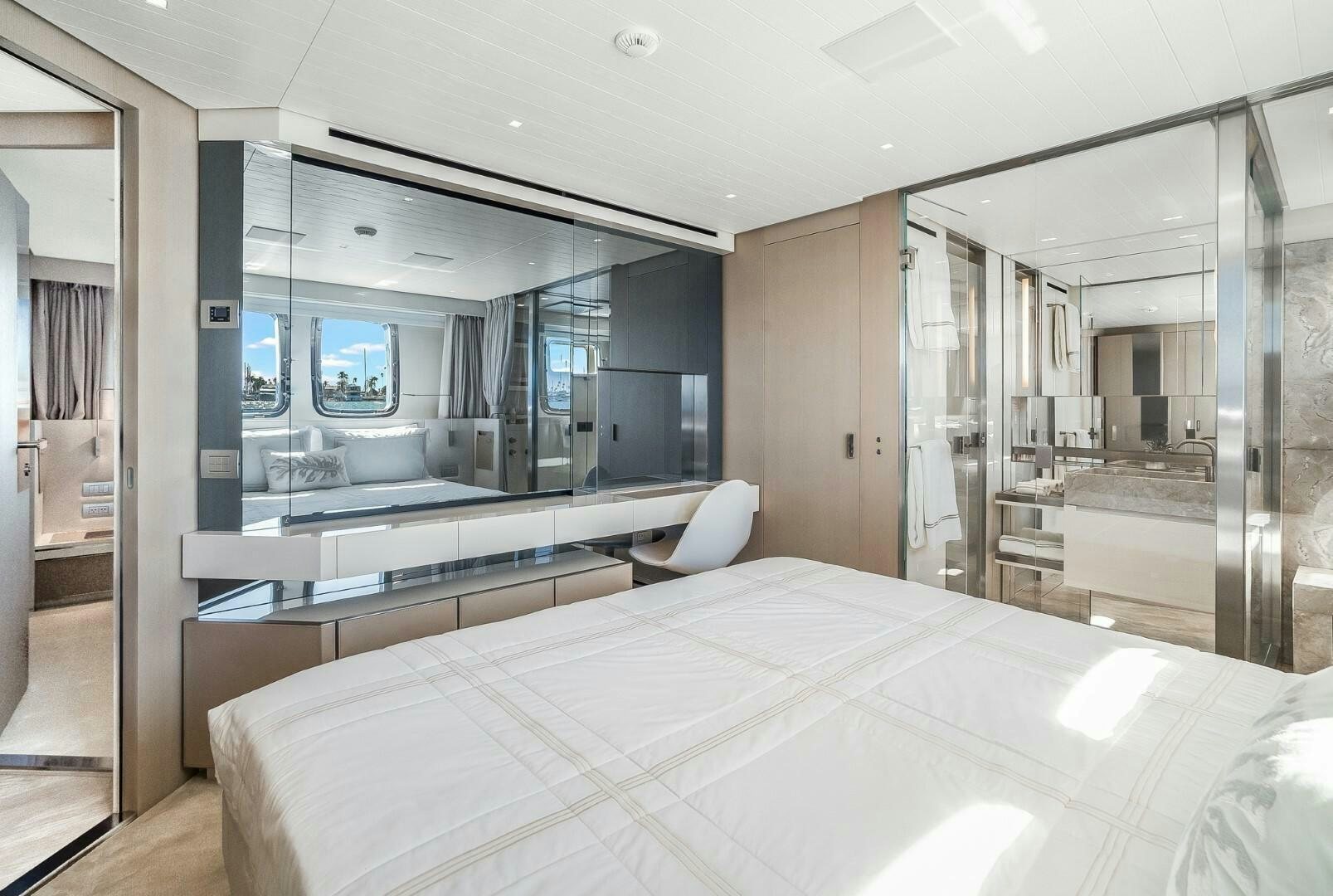 a large bedroom with a large bed aboard GENOA Yacht for Sale