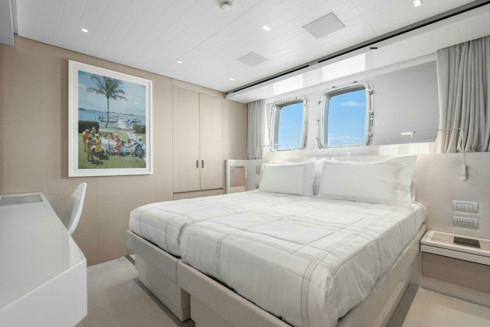 a room with a bed and a window aboard GENOA Yacht for Sale