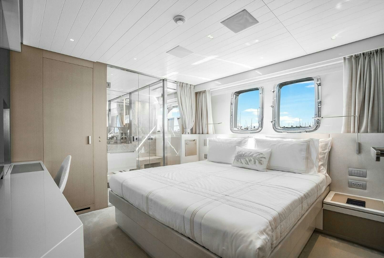 a room with a bed and a window aboard GENOA Yacht for Sale