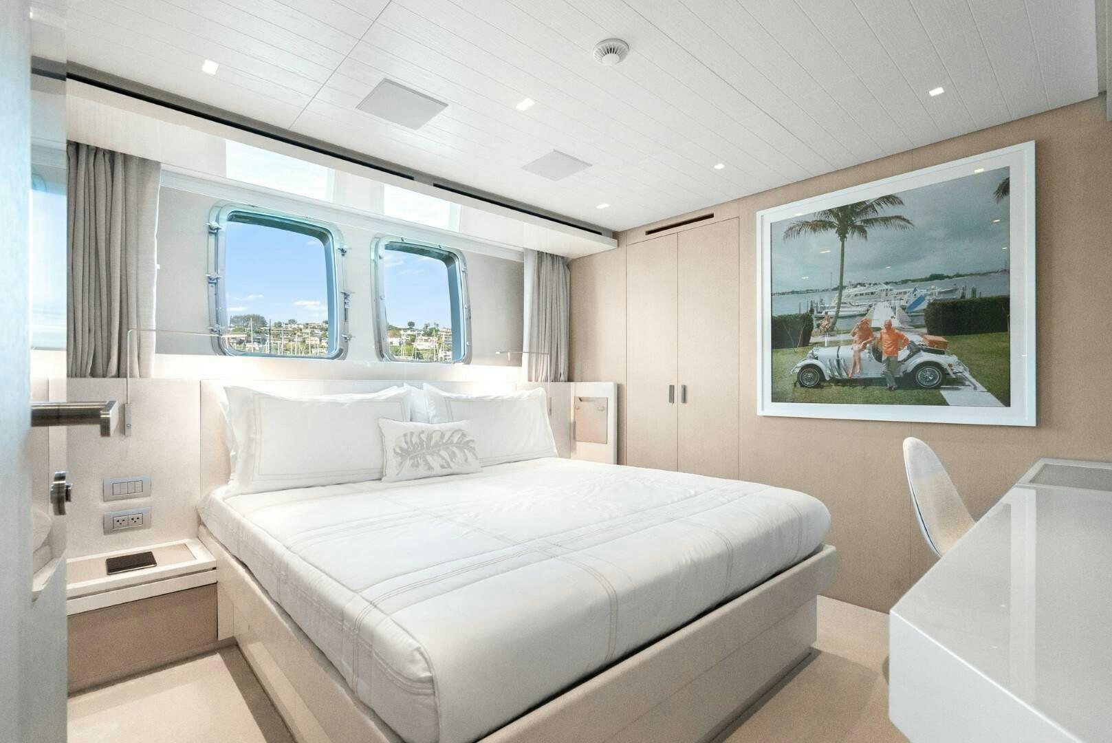 a room with a bed and a window aboard GENOA Yacht for Sale