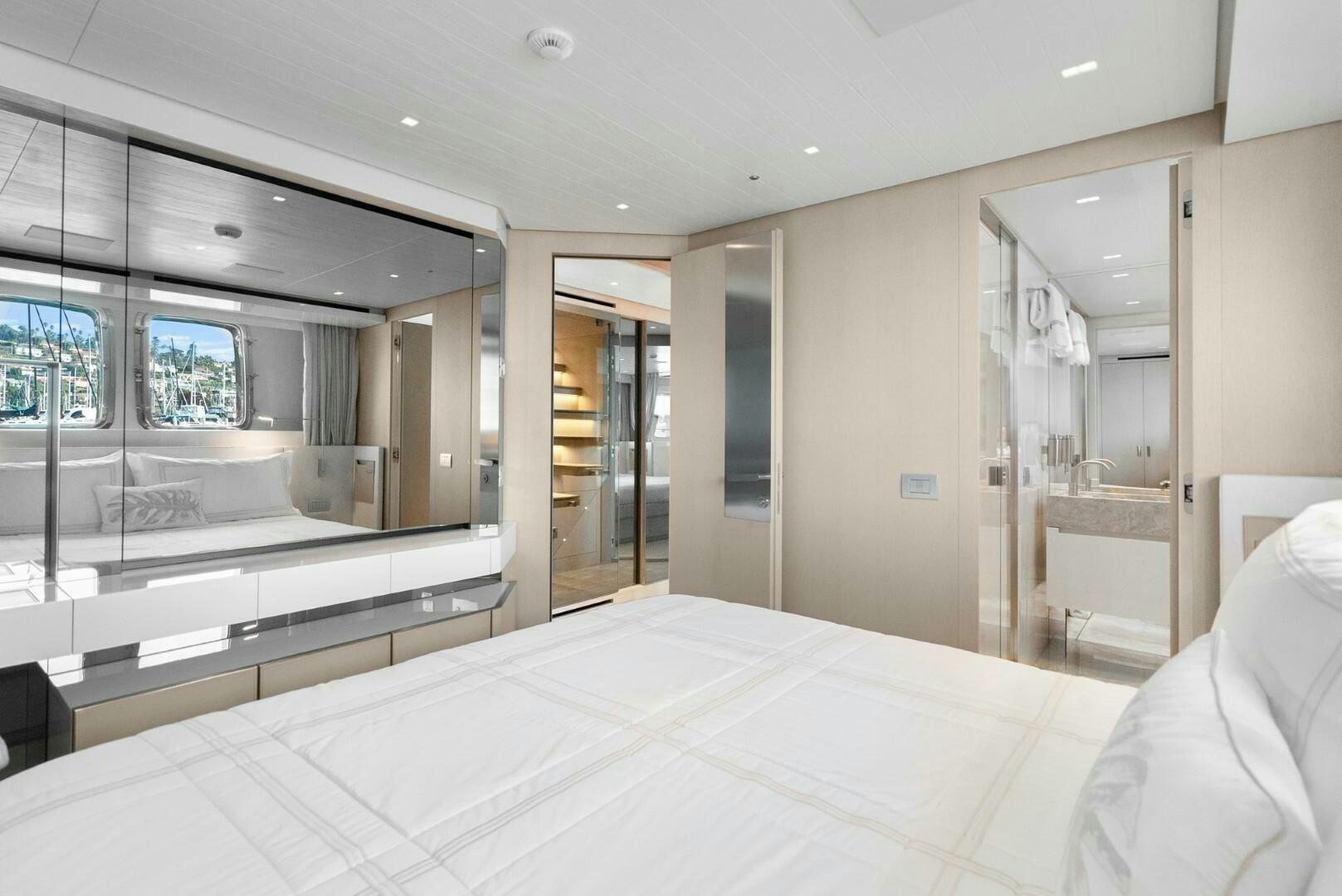 a large white bed in a room aboard GENOA Yacht for Sale