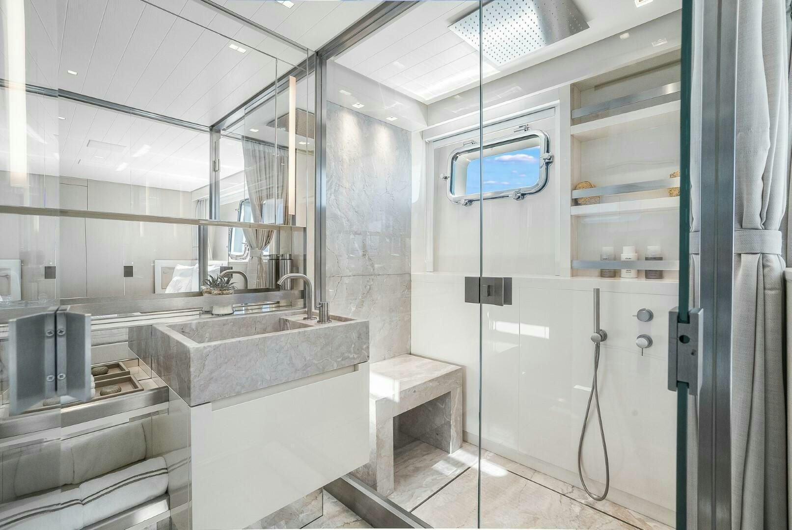 a bathroom with a sink and a mirror aboard GENOA Yacht for Sale