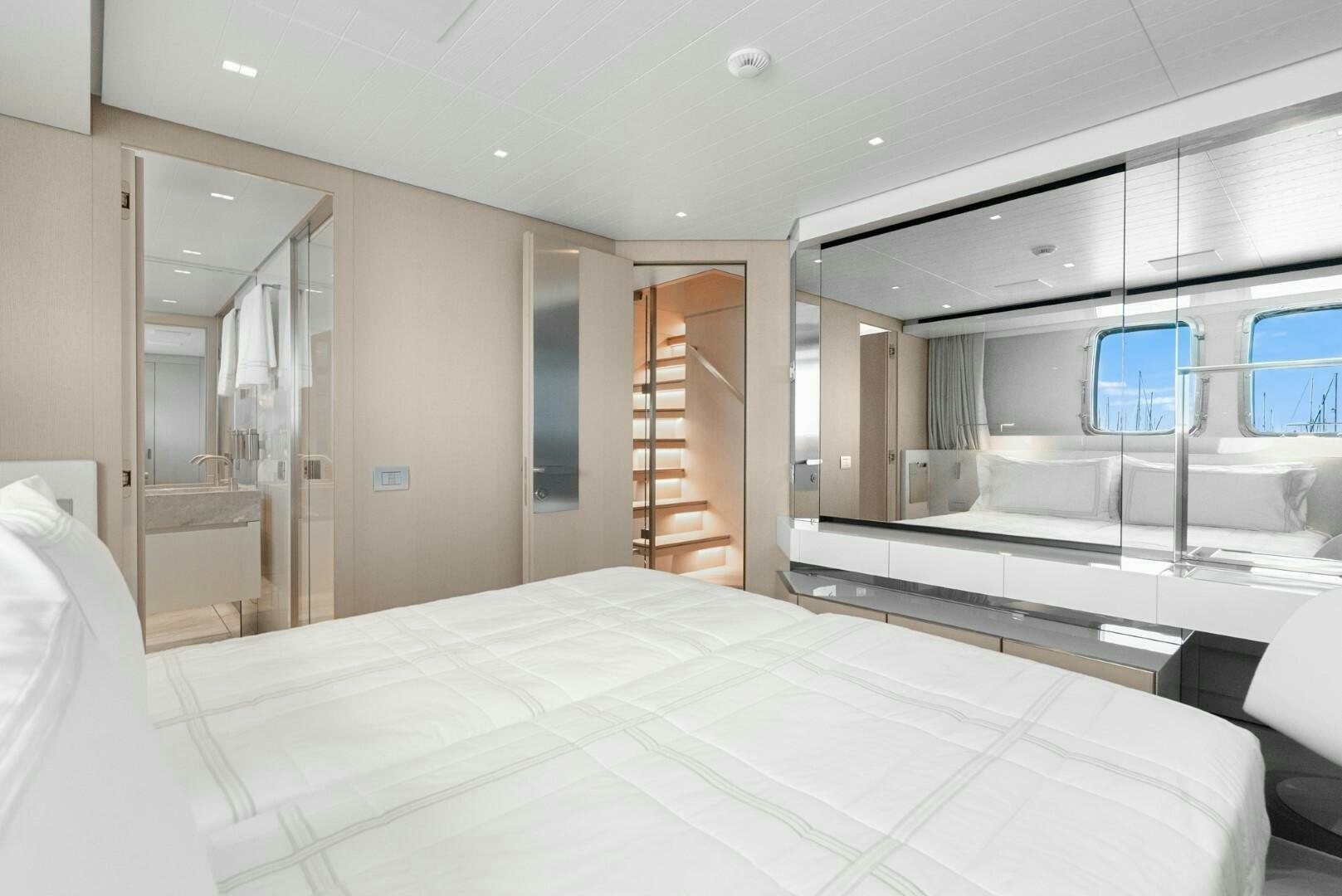 a room with a bed and a window aboard GENOA Yacht for Sale