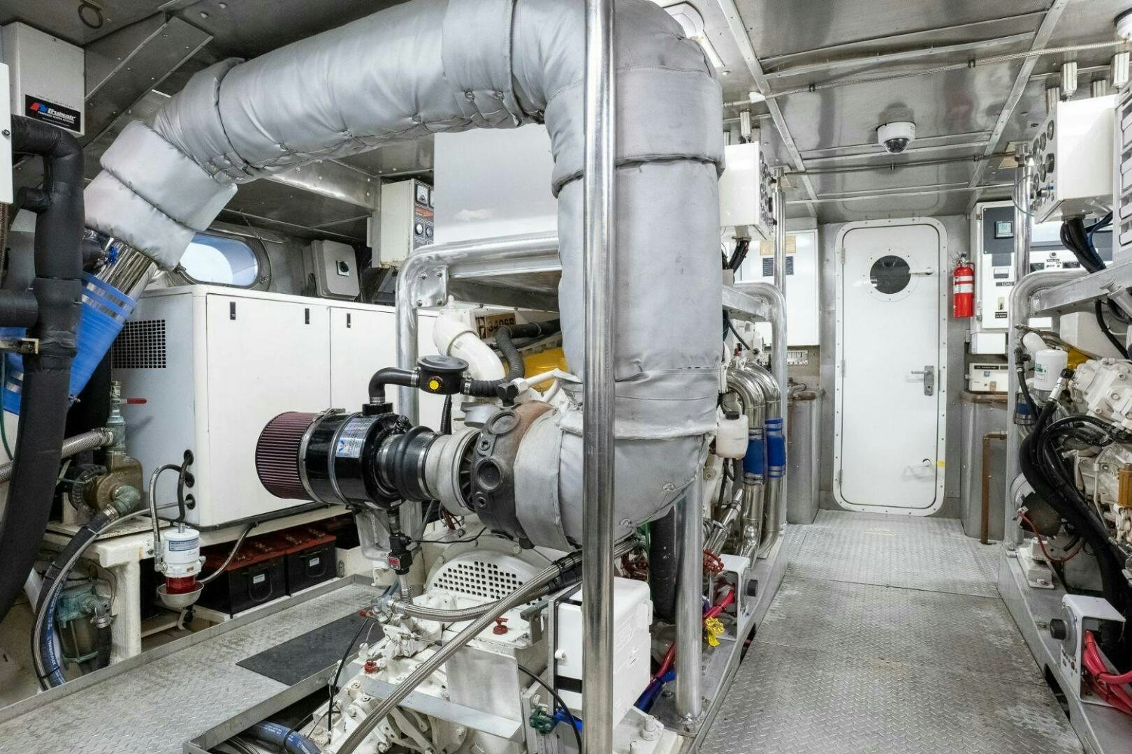 a large machine in a room aboard DOZER Yacht for Sale