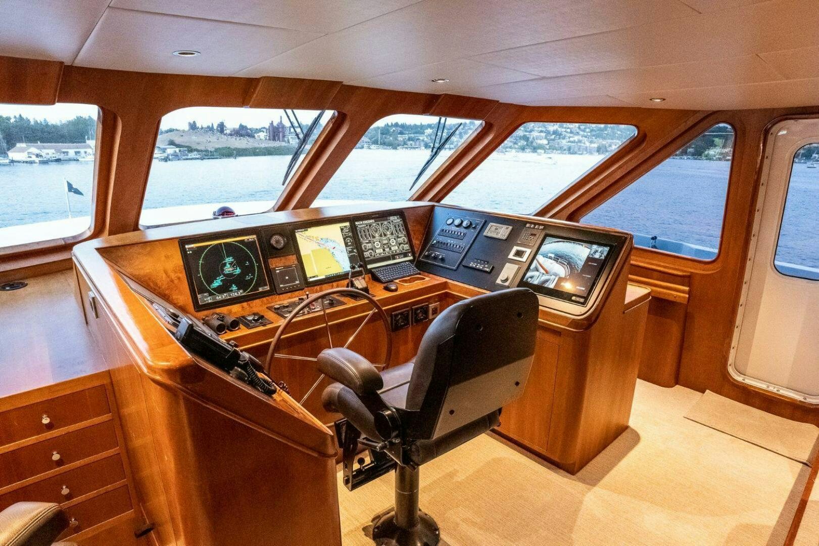 a room with a desk and computers aboard DOZER Yacht for Sale