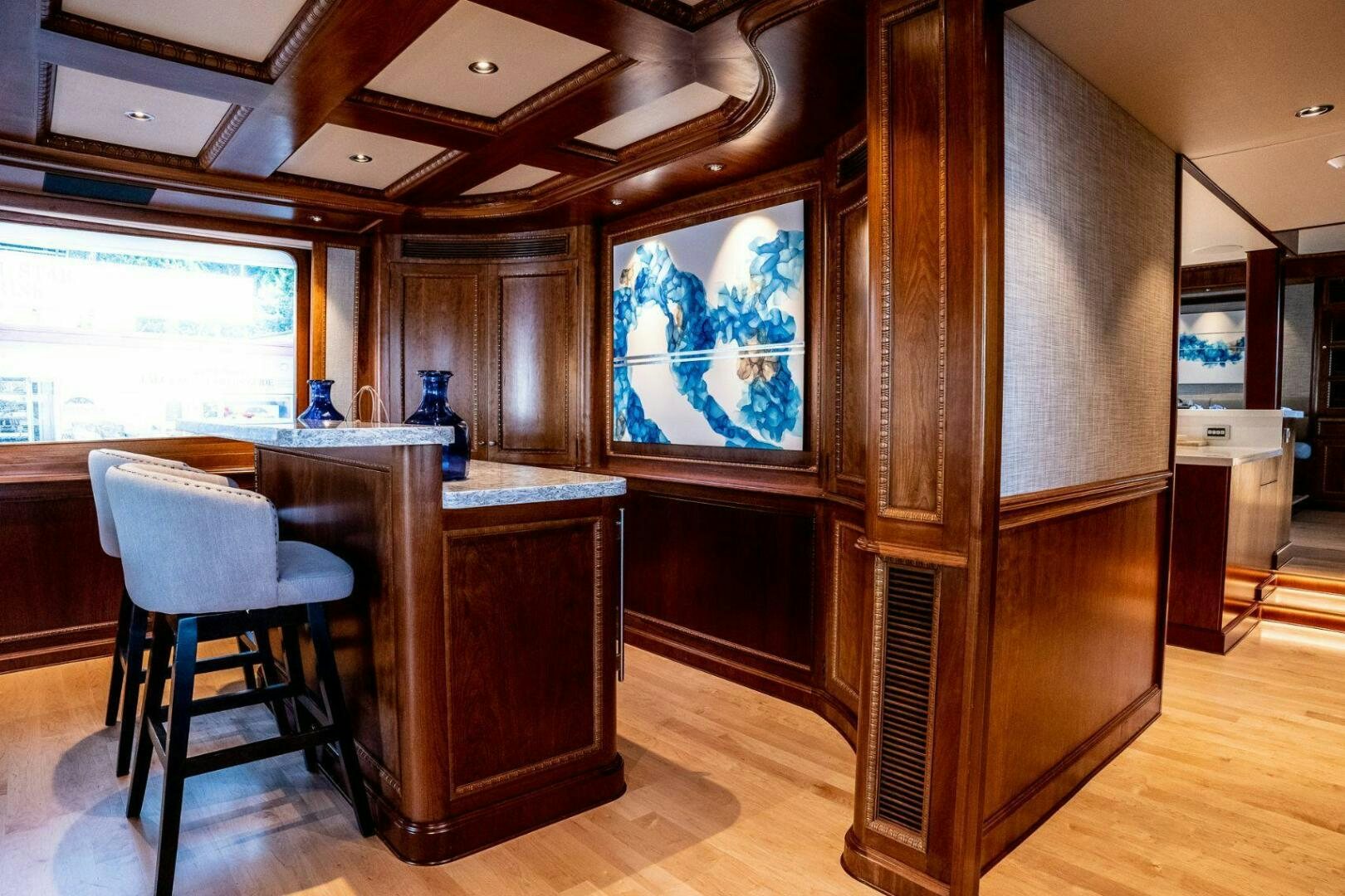 a room with a desk and a window aboard DOZER Yacht for Sale
