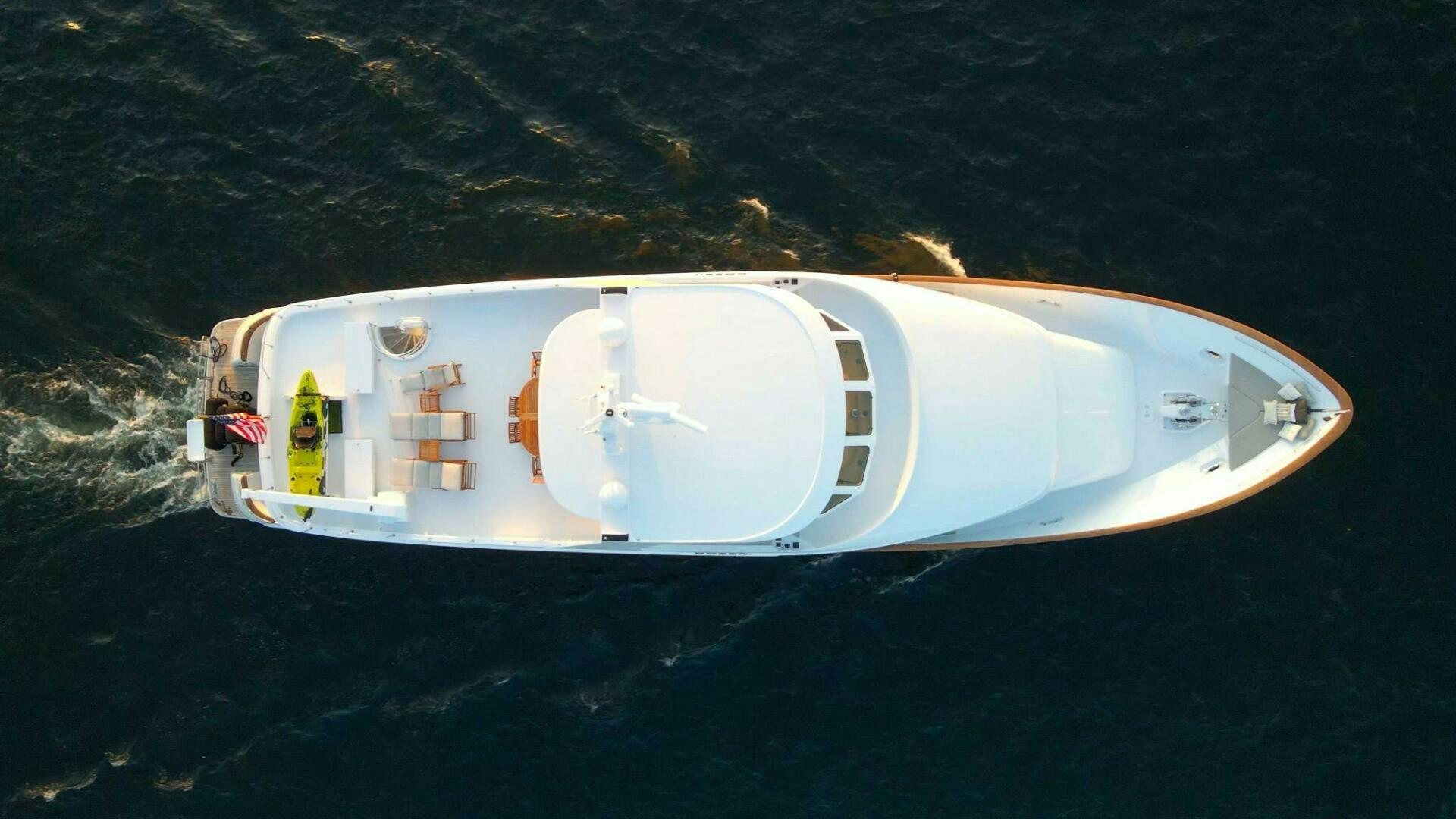 a white car with a white door aboard DOZER Yacht for Sale