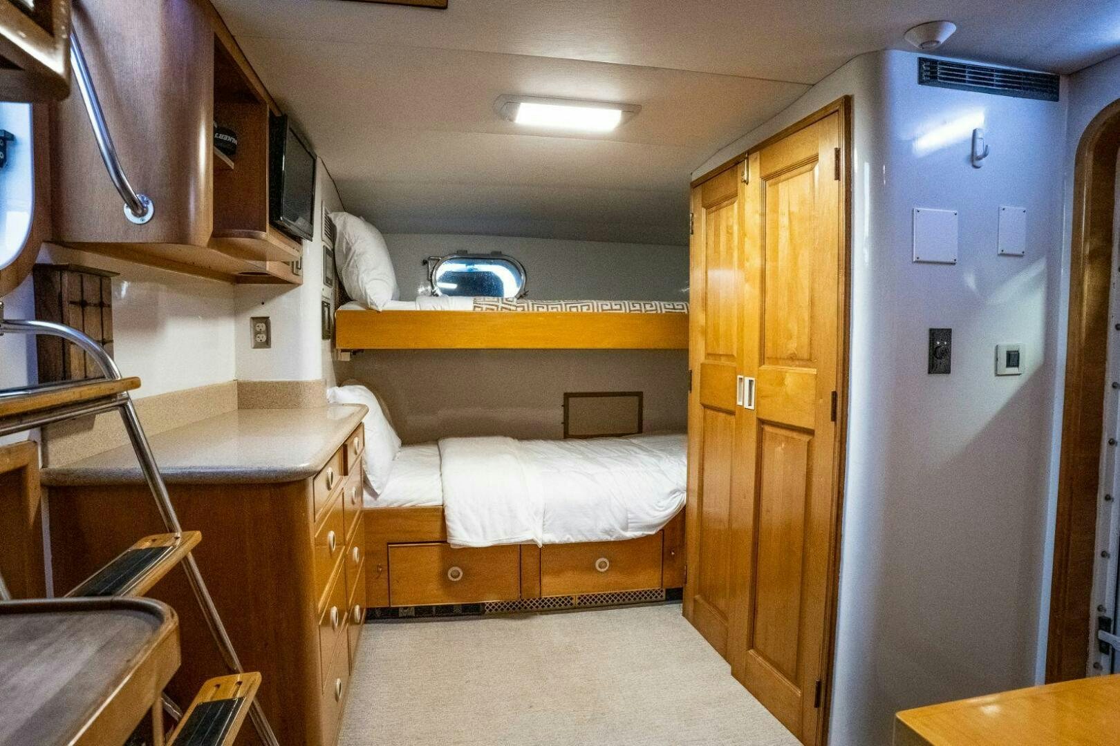 a room with bunk beds aboard DOZER Yacht for Sale