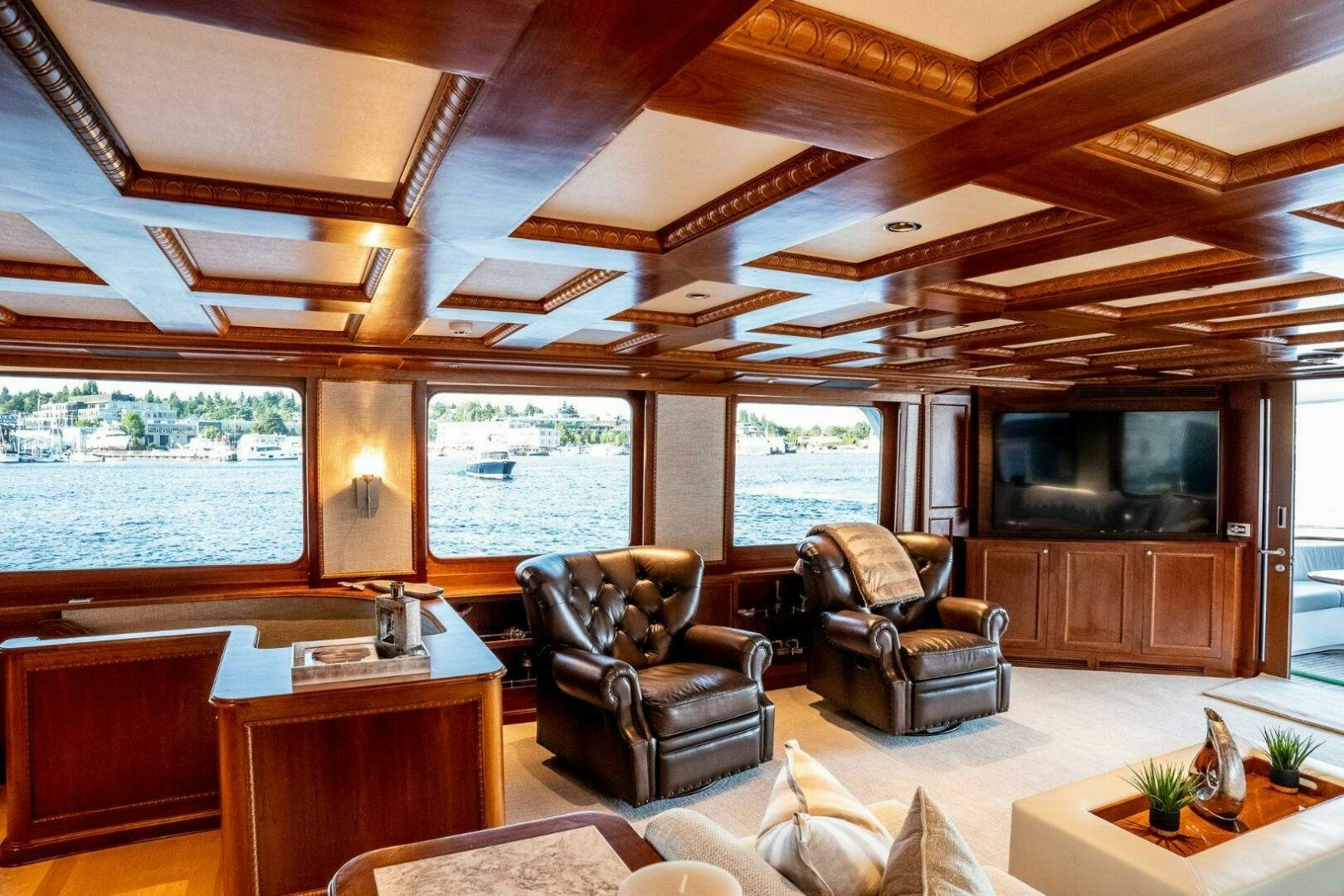 a living room with a wood ceiling aboard DOZER Yacht for Sale