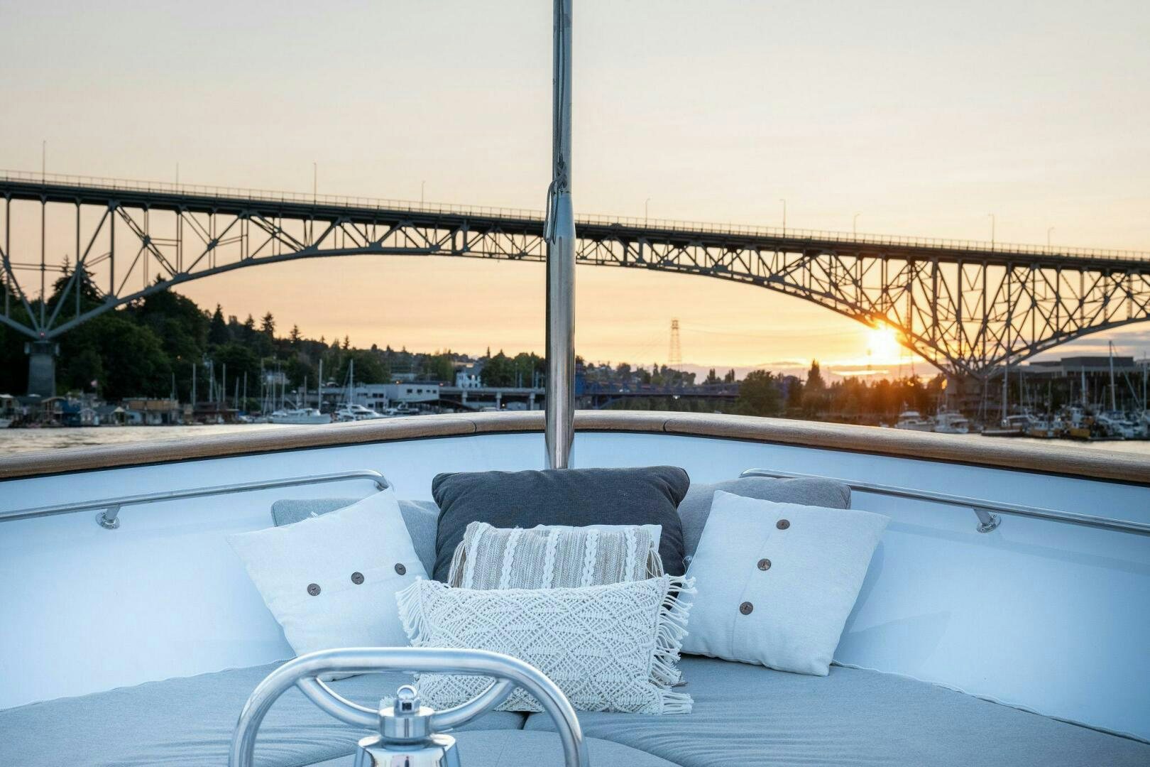 a rooftop with a view of a city and a large bridge aboard DOZER Yacht for Sale