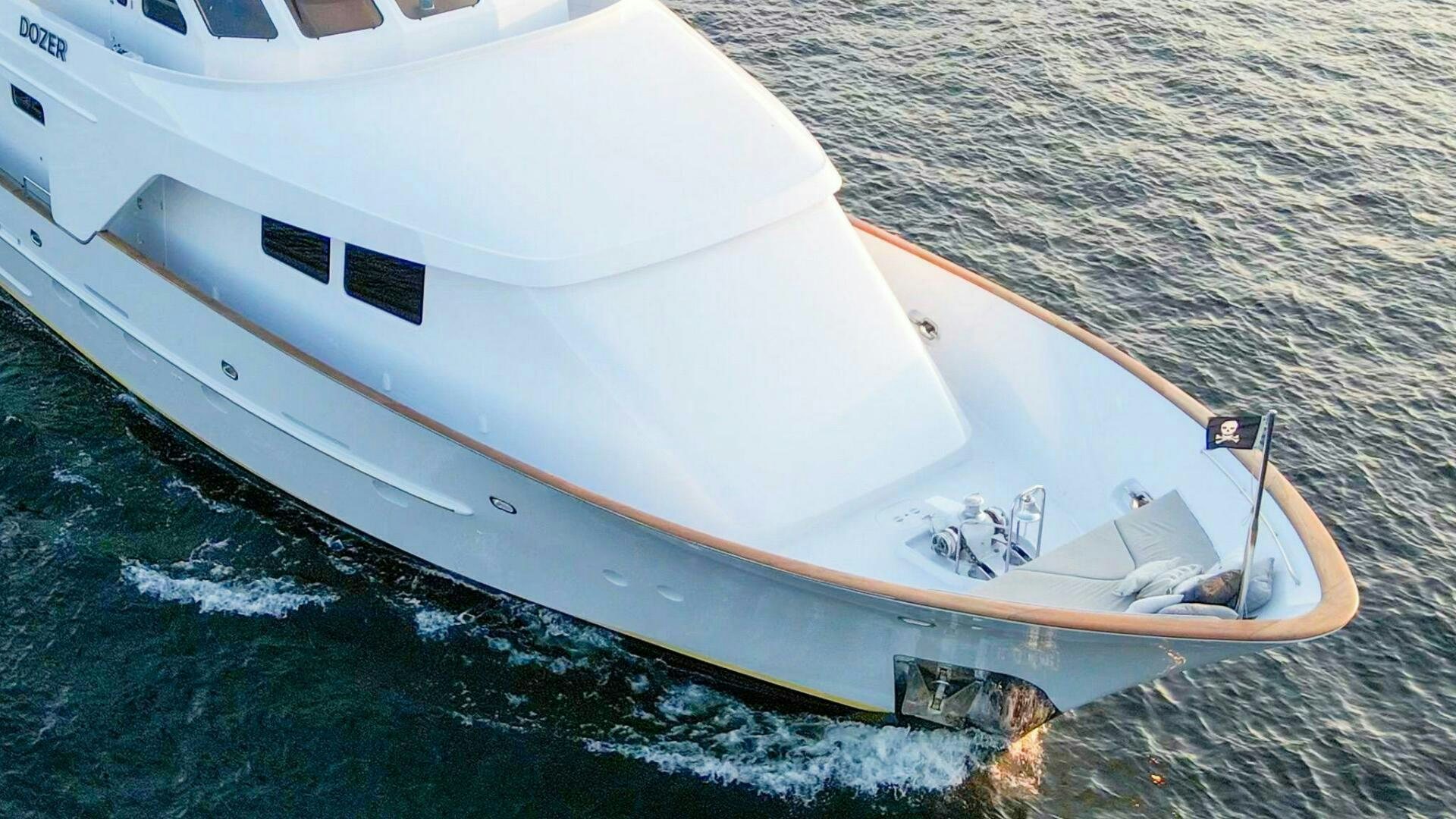 a white boat on the water aboard DOZER Yacht for Sale