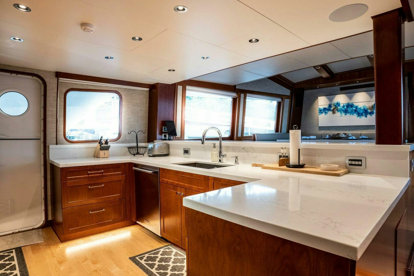 a kitchen with a large island aboard DOZER Yacht for Sale