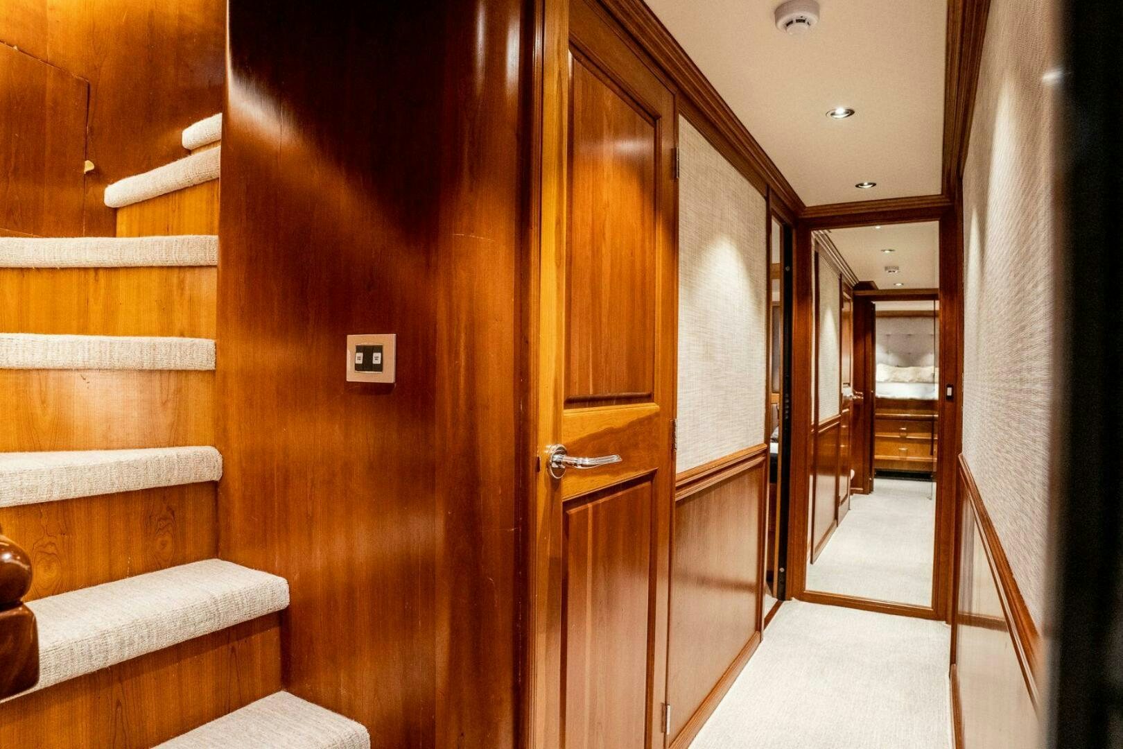 a room with wooden doors aboard DOZER Yacht for Sale