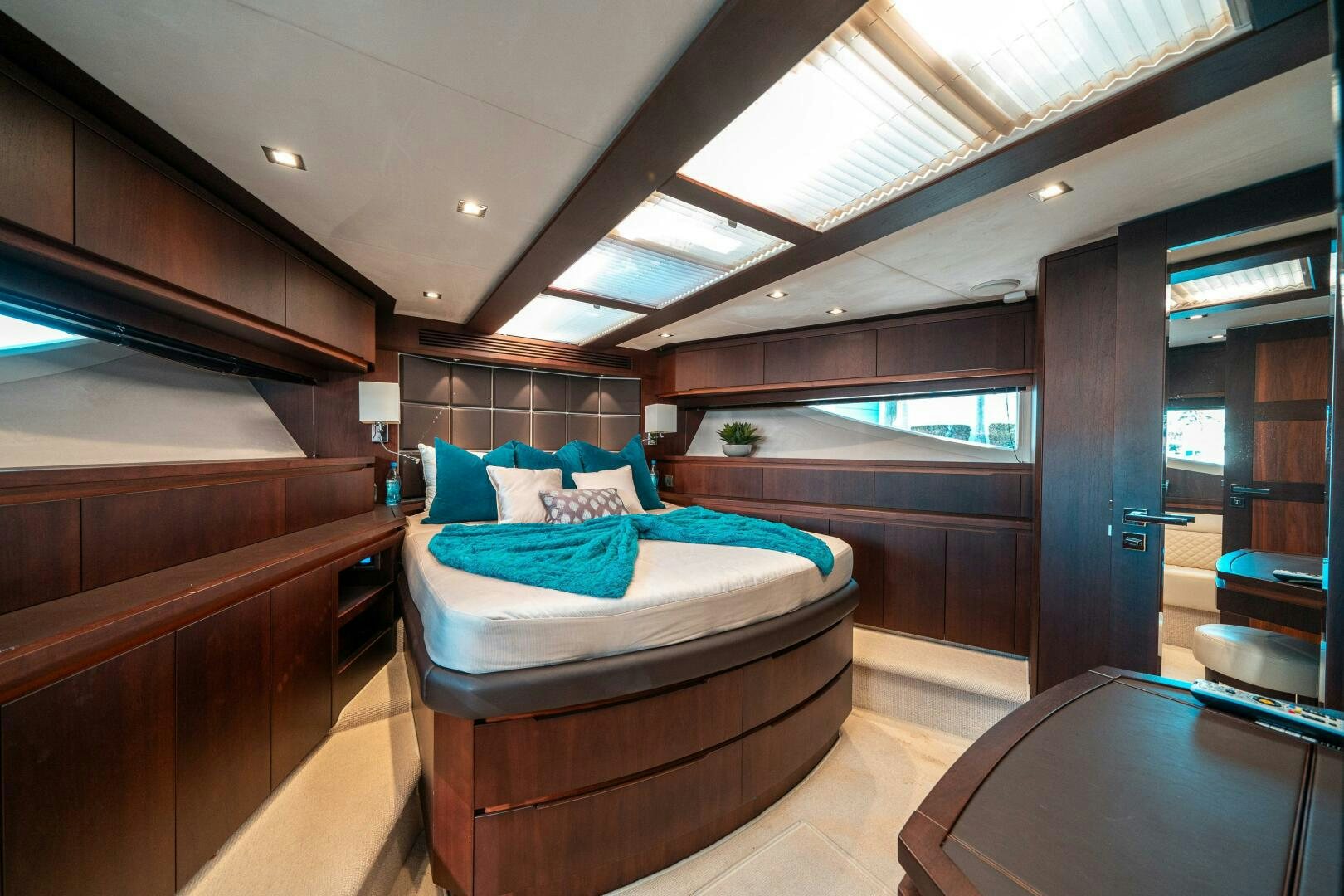 a room with a bed and a table aboard OPTIMUS PRIME Yacht for Sale