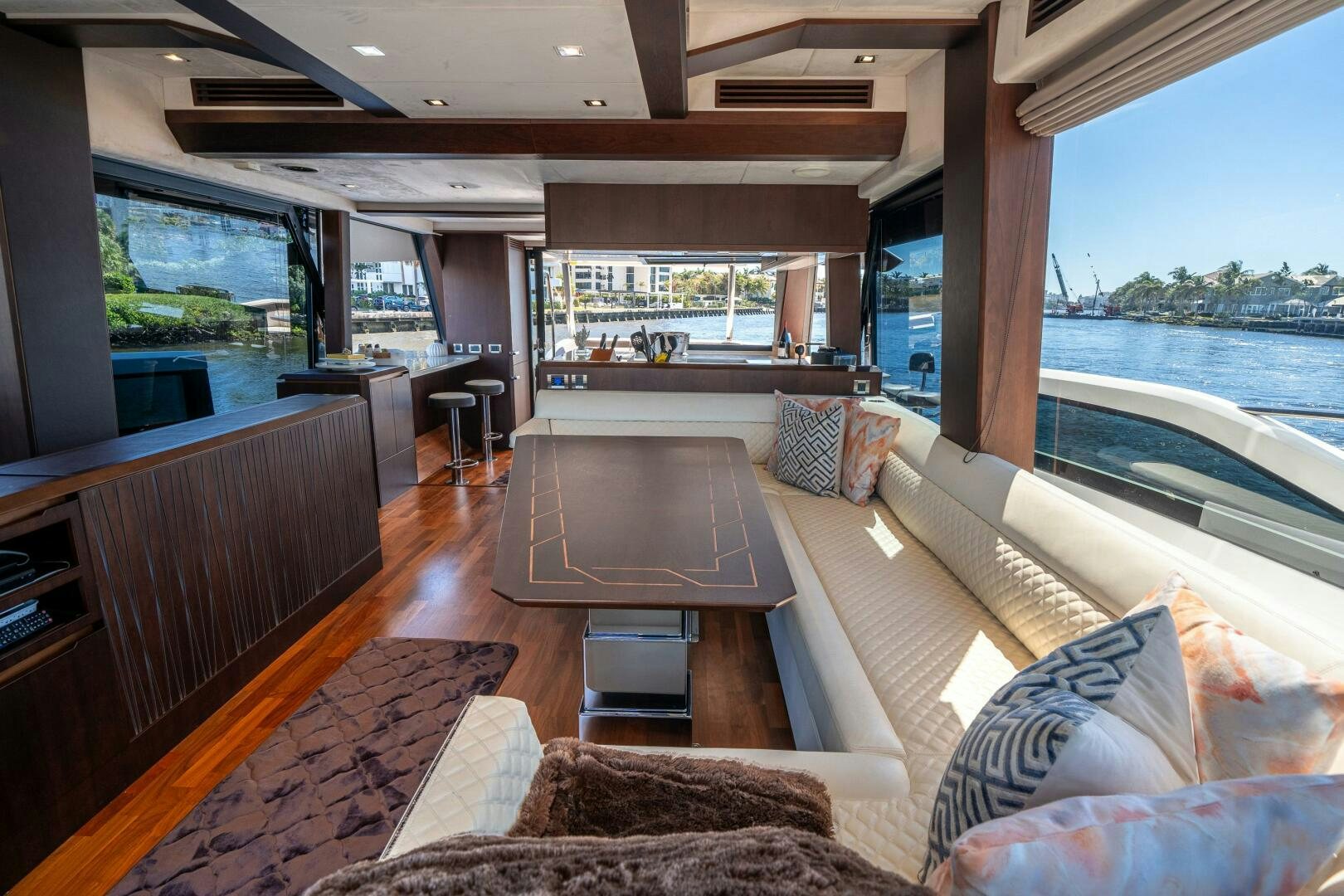 a living room with a wood floor aboard OPTIMUS PRIME Yacht for Sale