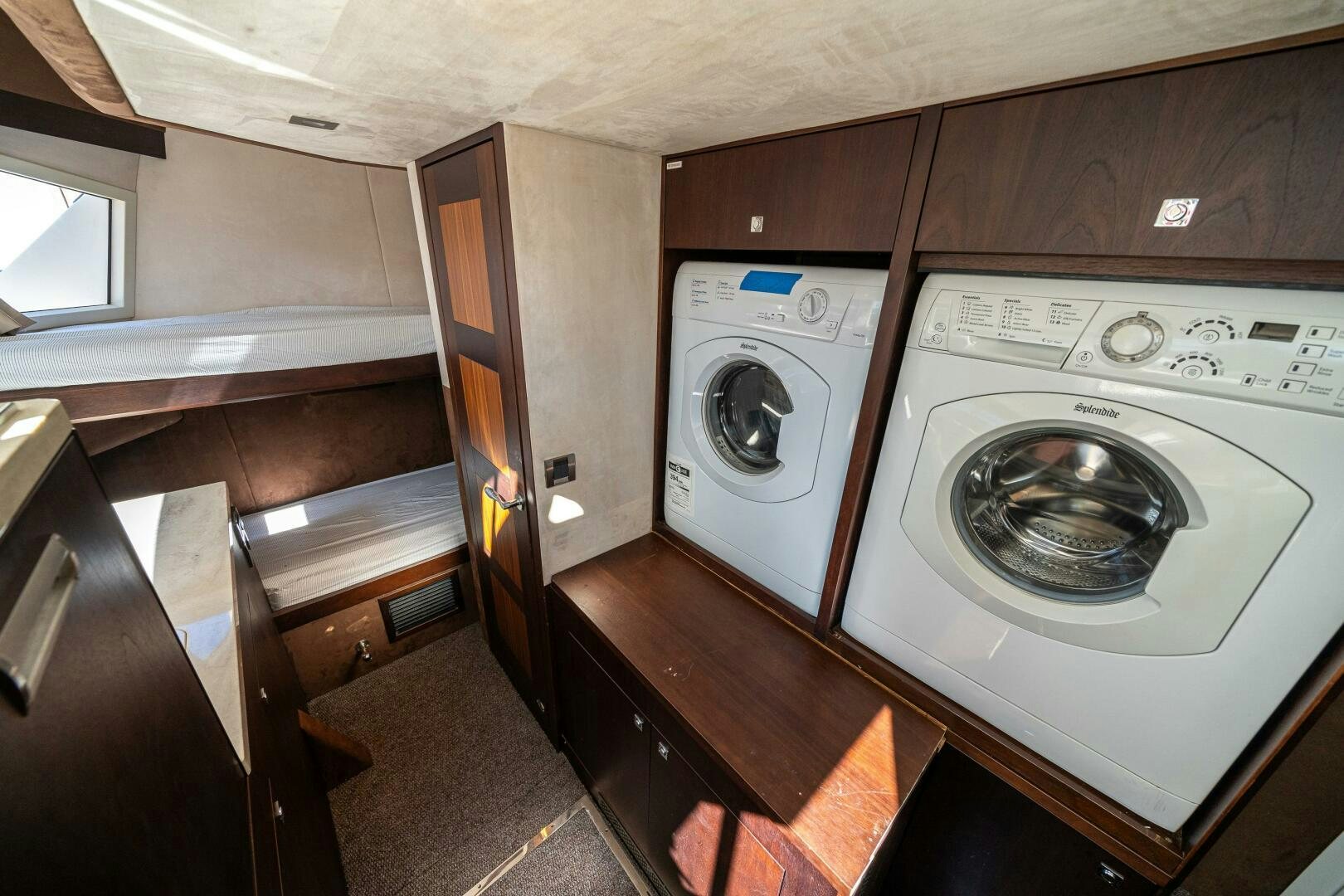 a kitchen with a washing machine aboard OPTIMUS PRIME Yacht for Sale