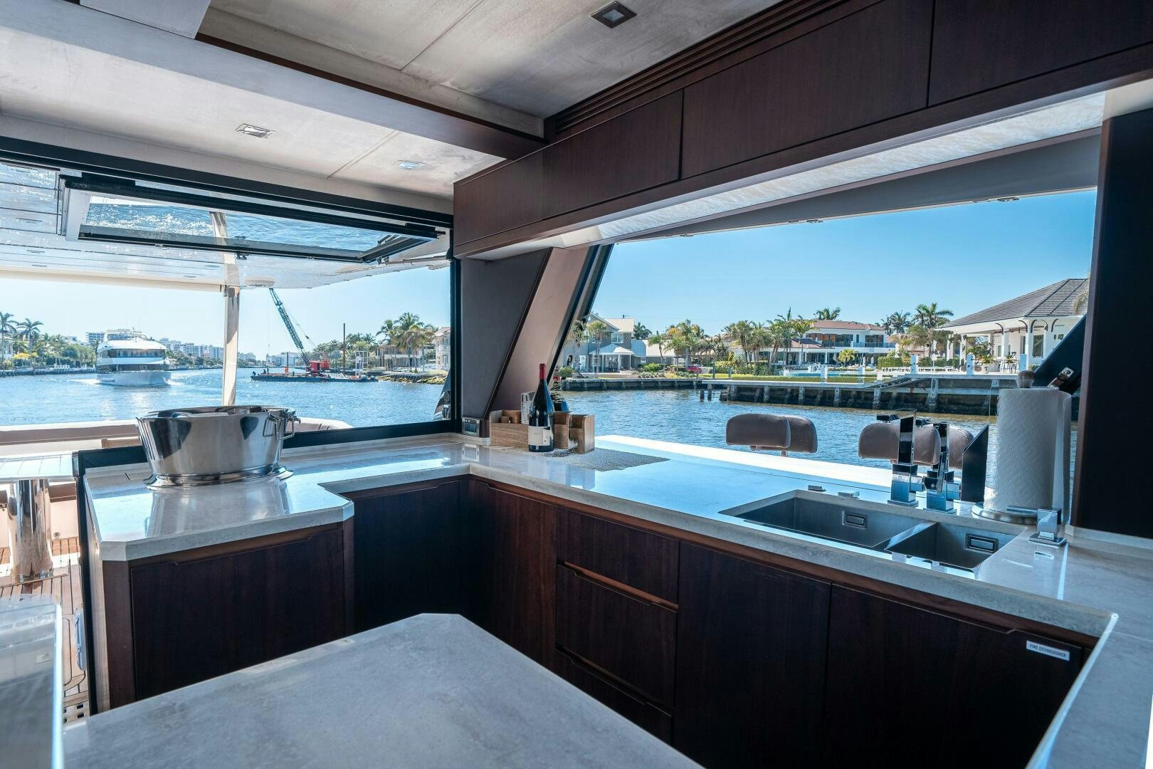 a kitchen with a view of the ocean and the ocean aboard OPTIMUS PRIME Yacht for Sale