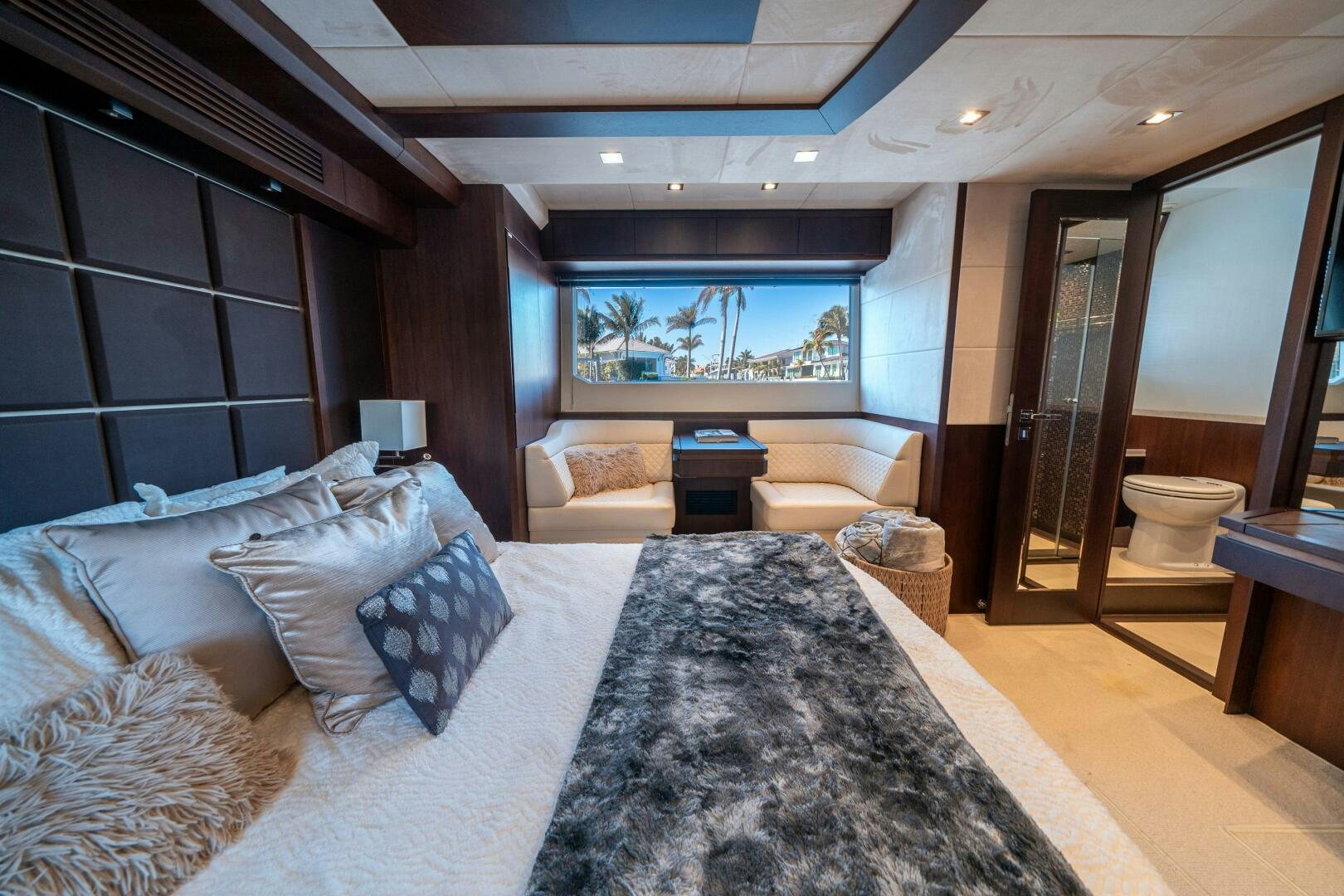 a large bedroom with a large bed aboard OPTIMUS PRIME Yacht for Sale