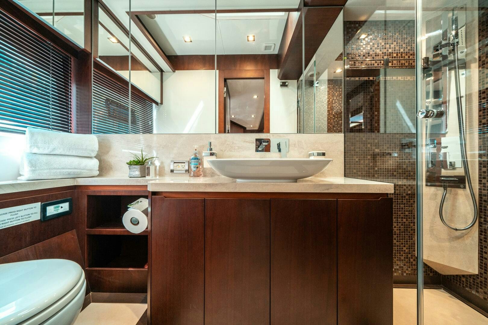 a bathroom with a sink and a shower aboard OPTIMUS PRIME Yacht for Sale
