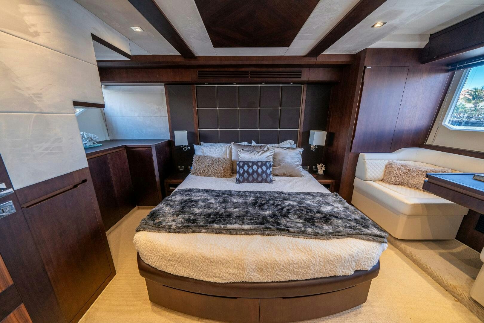 a bedroom with a large bed aboard OPTIMUS PRIME Yacht for Sale