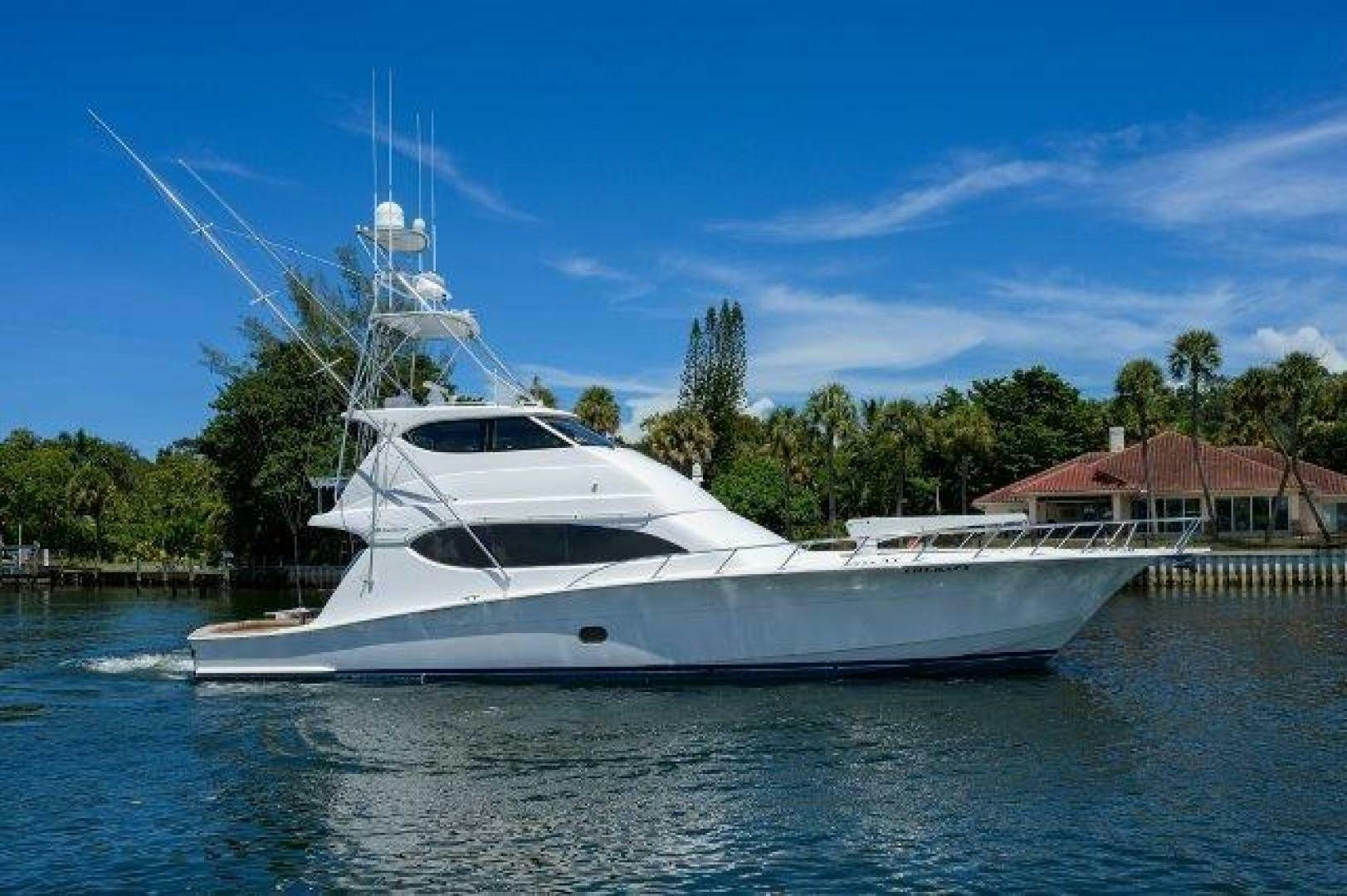 a white yacht on the water aboard BUZZ Yacht for Sale
