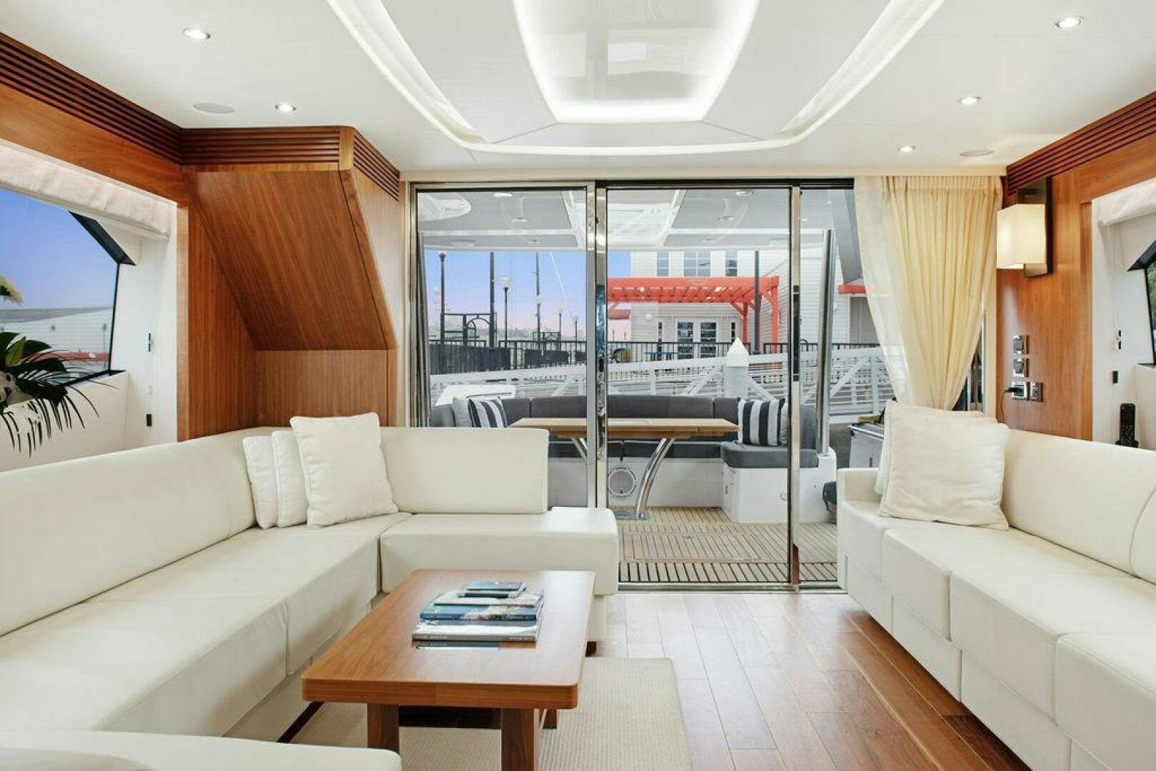 a living room with a large window aboard SEA LA VIE Yacht for Sale