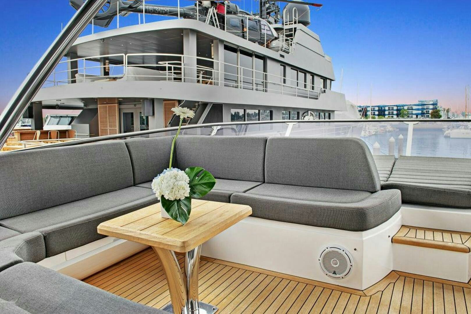 a couch and a table on a deck aboard SEA LA VIE Yacht for Sale
