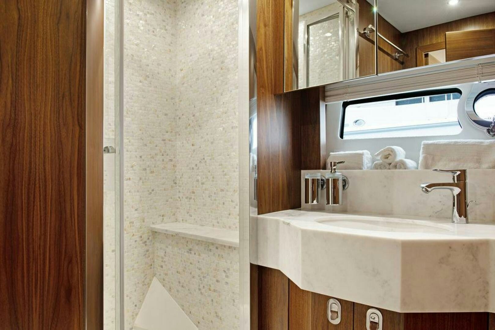 a bathroom with a sink and a mirror aboard SEA LA VIE Yacht for Sale
