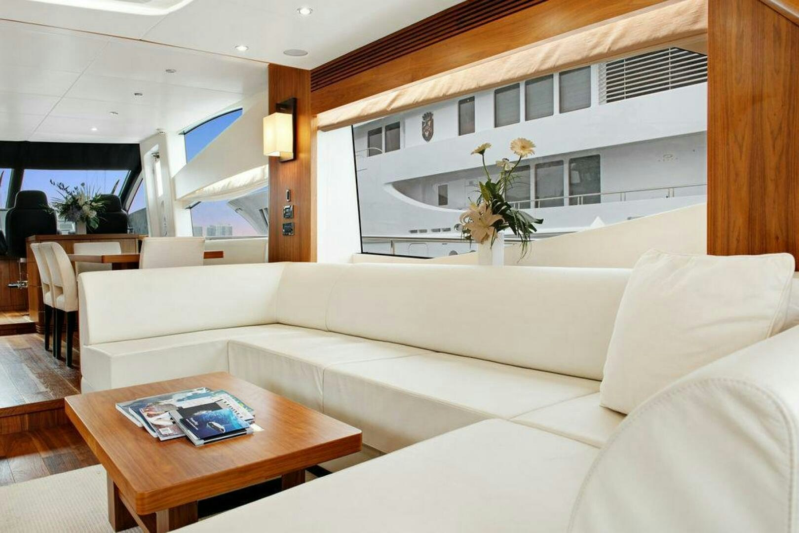 a living room with a couch and a coffee table aboard SEA LA VIE Yacht for Sale