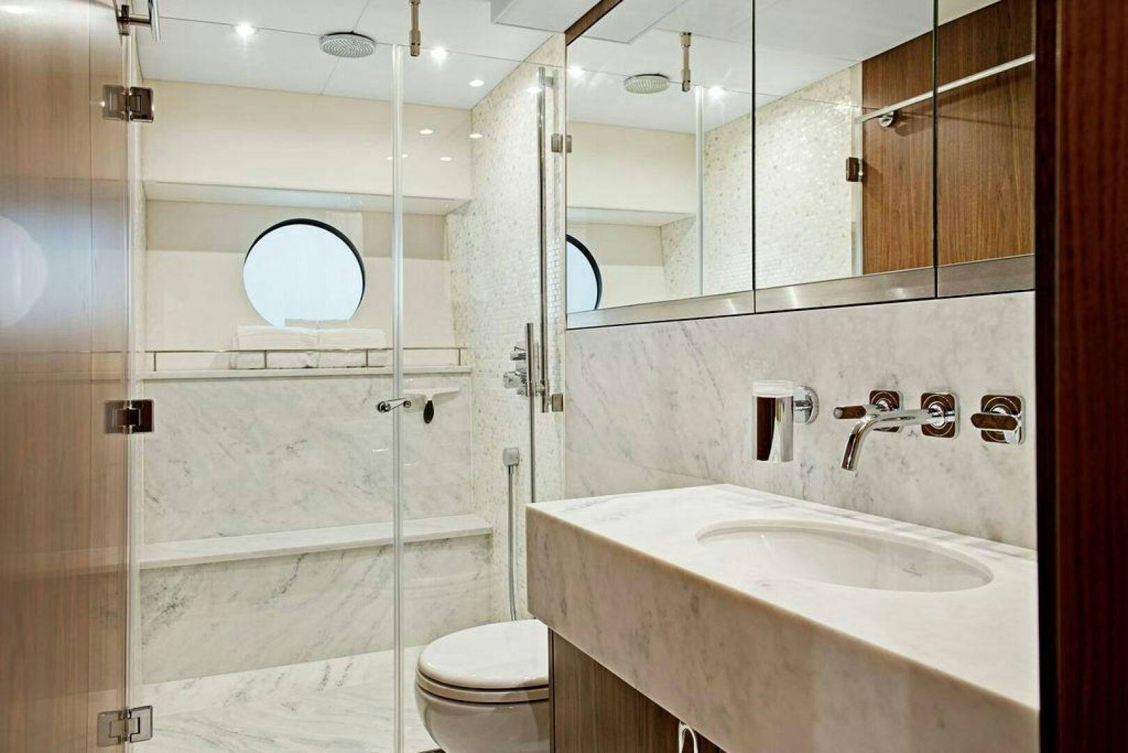 a bathroom with a glass shower door aboard SEA LA VIE Yacht for Sale