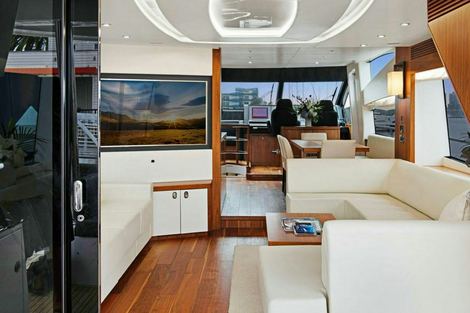a living room with a large screen aboard SEA LA VIE Yacht for Sale