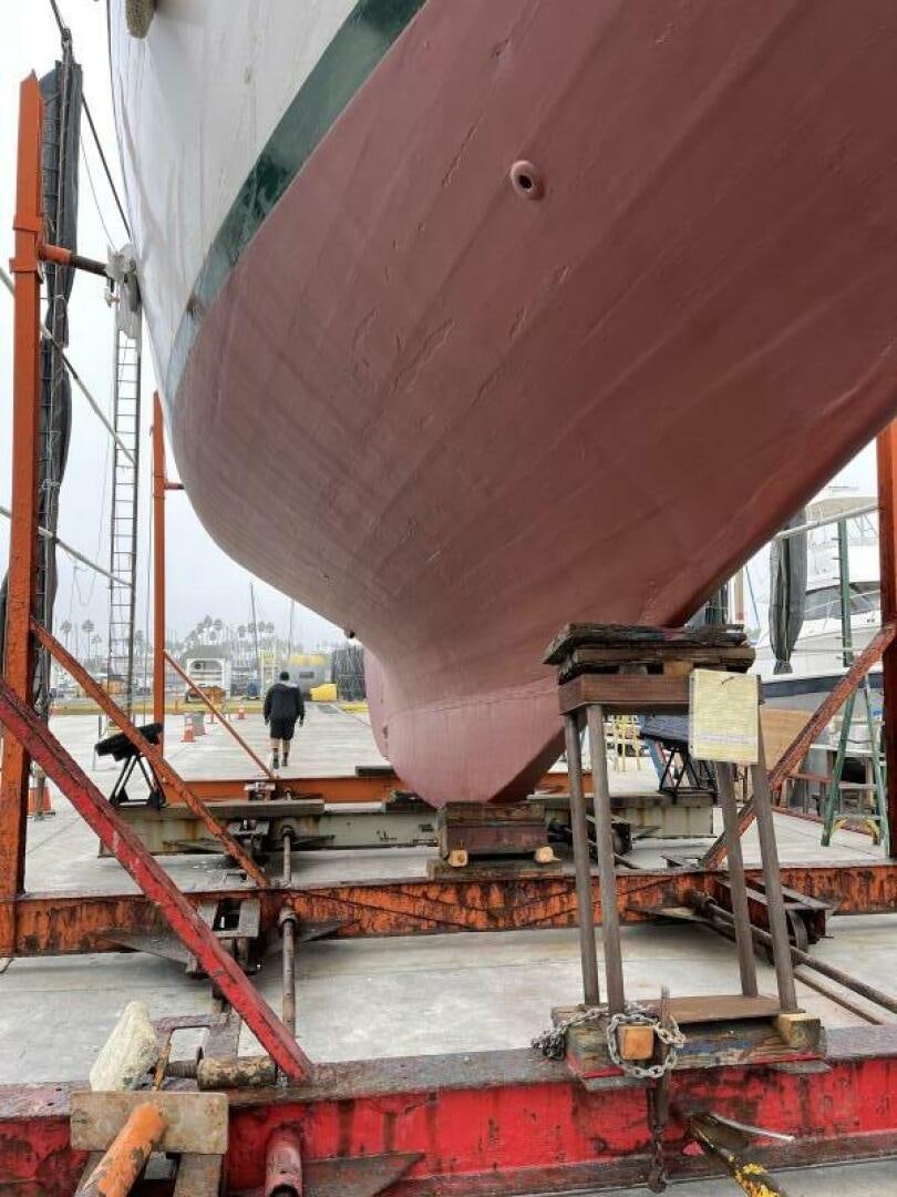 a large red machine aboard CURLEW Yacht for Sale