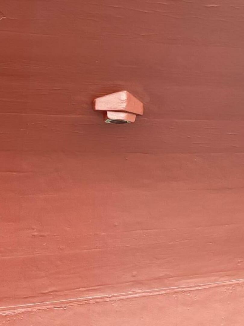 a small paper on a table aboard CURLEW Yacht for Sale