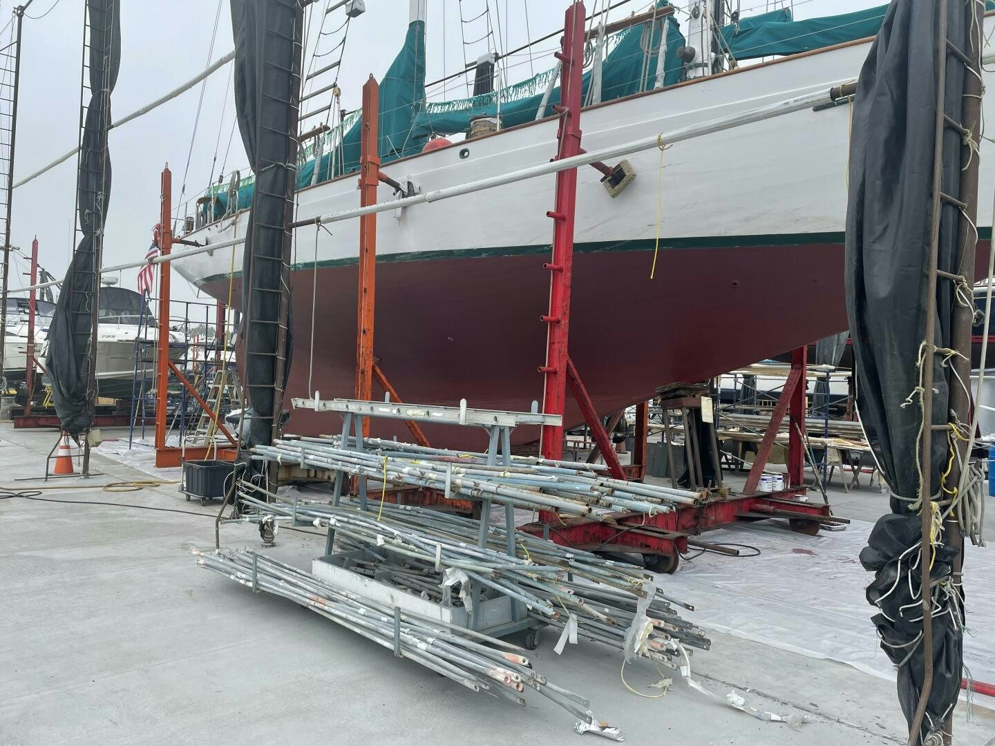 a large boat with red ropes aboard CURLEW Yacht for Sale