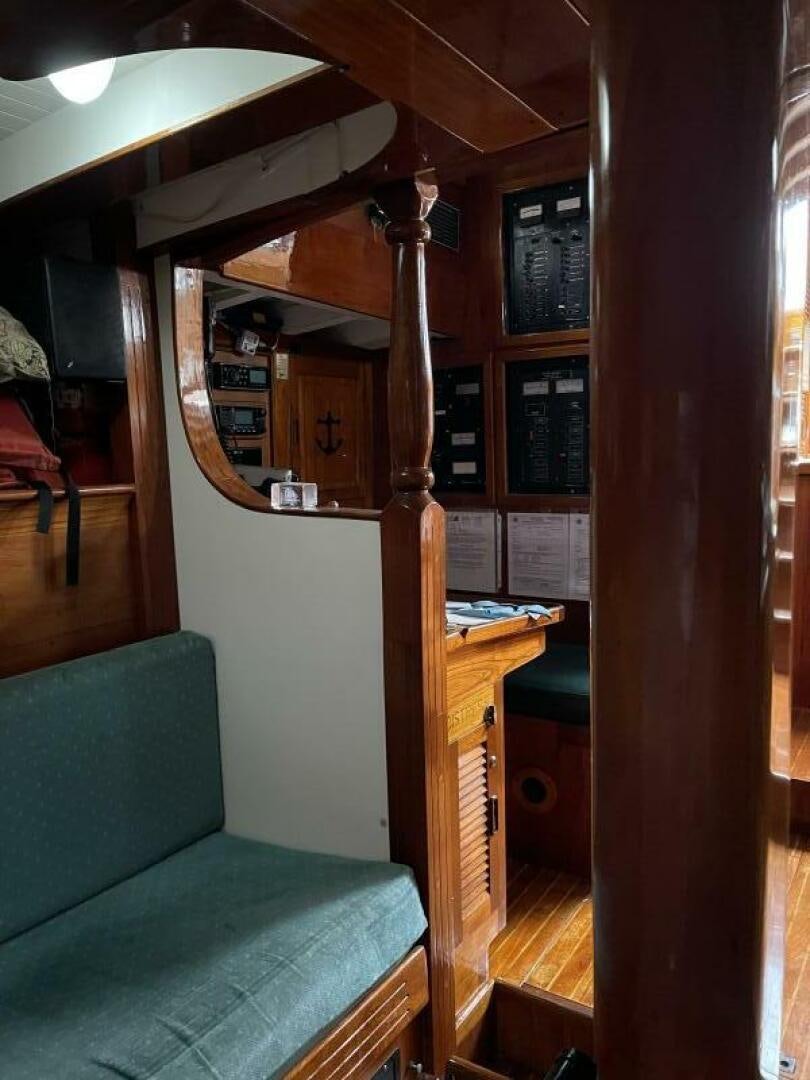 a room with a couch and a table aboard CURLEW Yacht for Sale