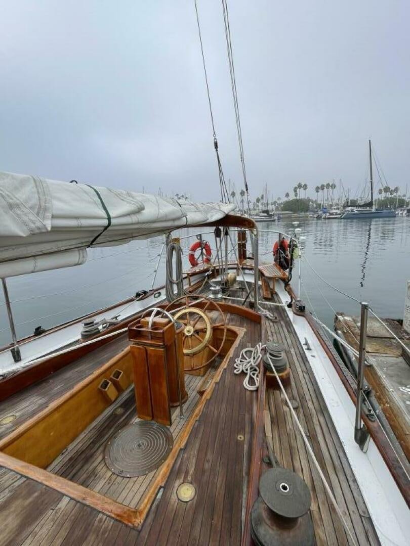 a boat with a steering wheel aboard CURLEW Yacht for Sale