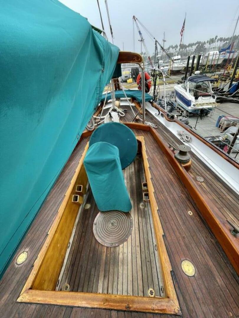 a large ship on the water aboard CURLEW Yacht for Sale