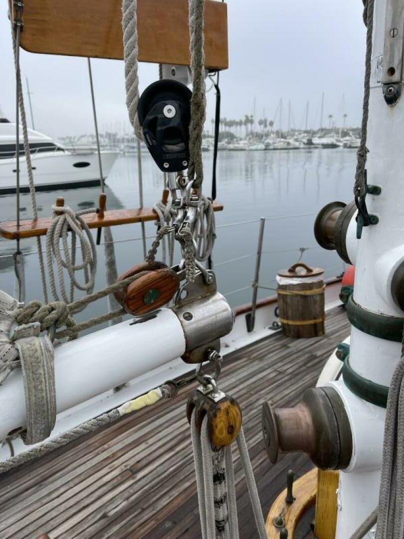 a boat with ropes and a steering wheel aboard CURLEW Yacht for Sale