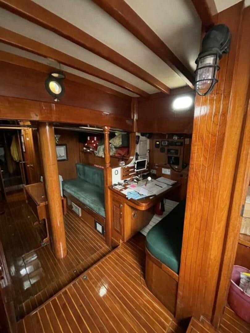 a room with a desk and a computer aboard CURLEW Yacht for Sale
