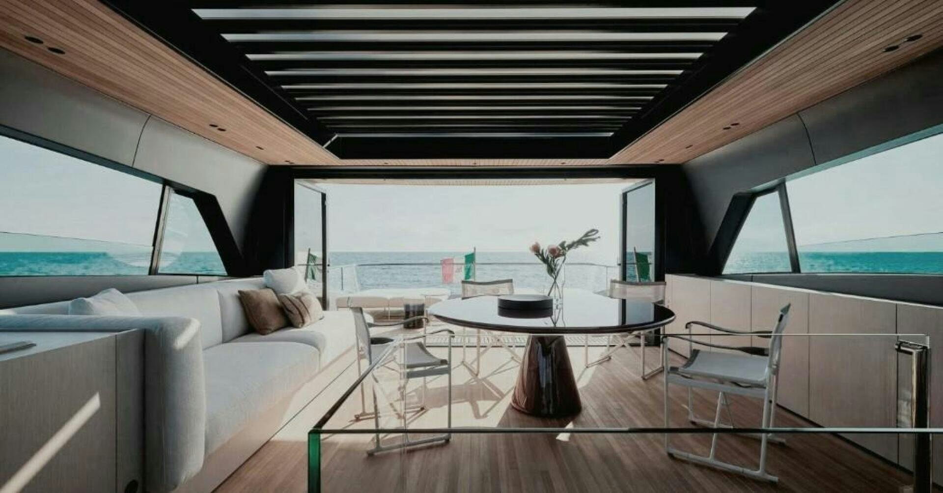 a living room with a large window aboard SX100 Yacht for Sale