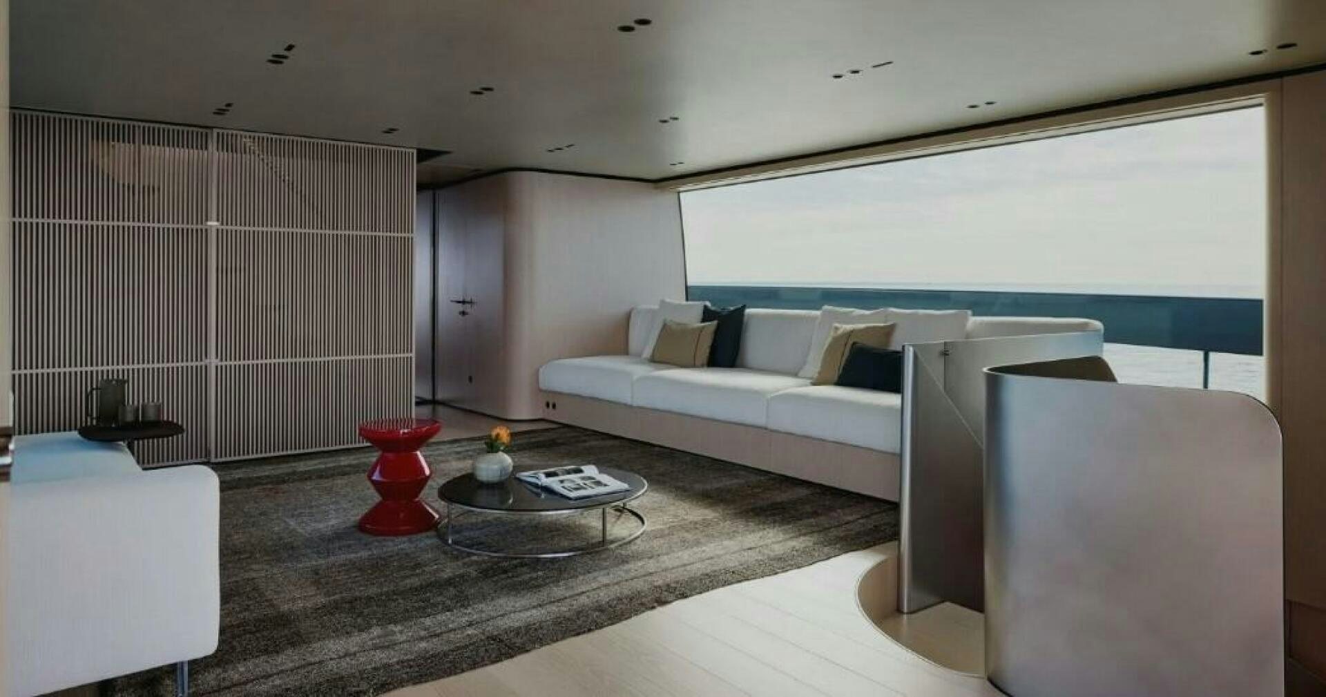 a living room with a couch and a table aboard SX100 Yacht for Sale