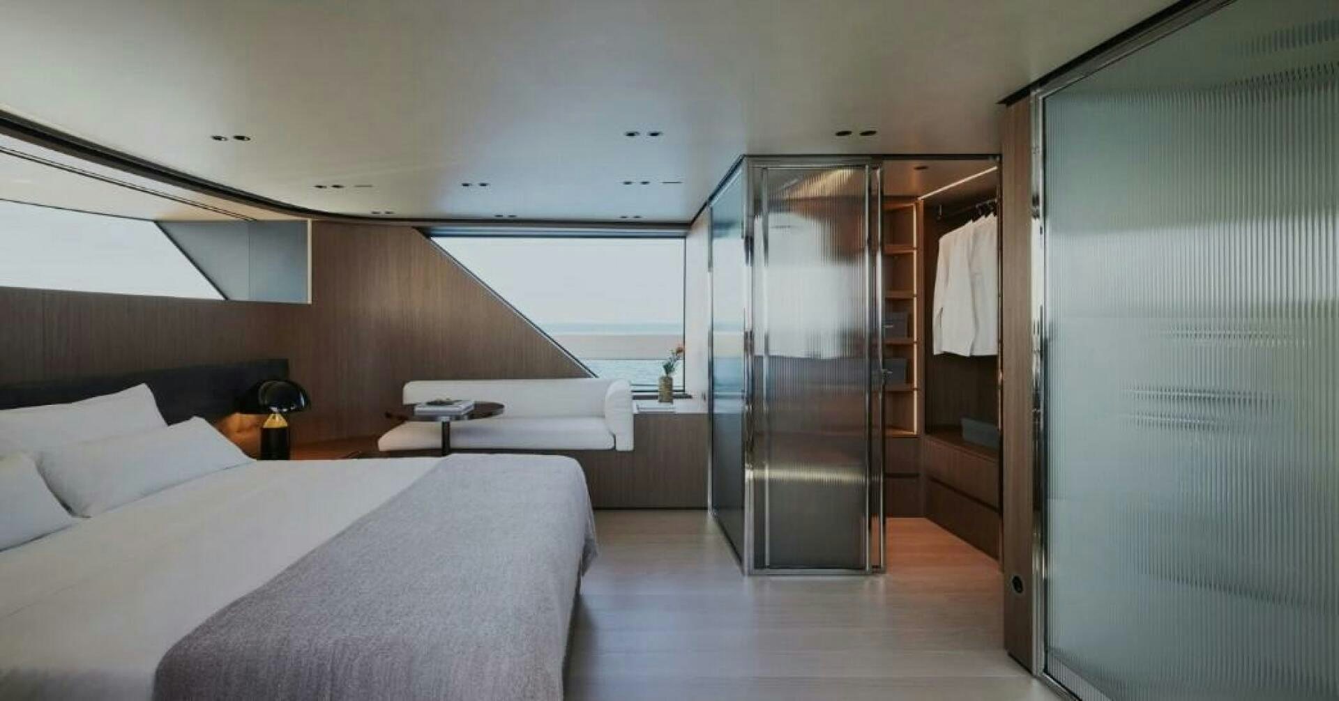 a room with a bed and a closet aboard SX100 Yacht for Sale