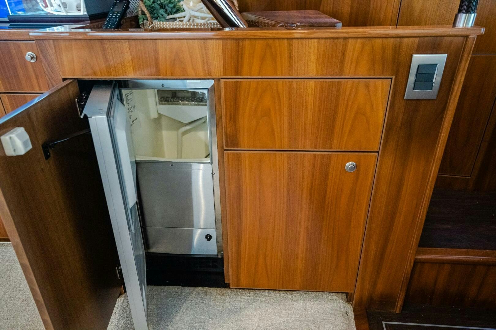 a kitchen with wooden cabinets aboard HOORAY Yacht for Sale