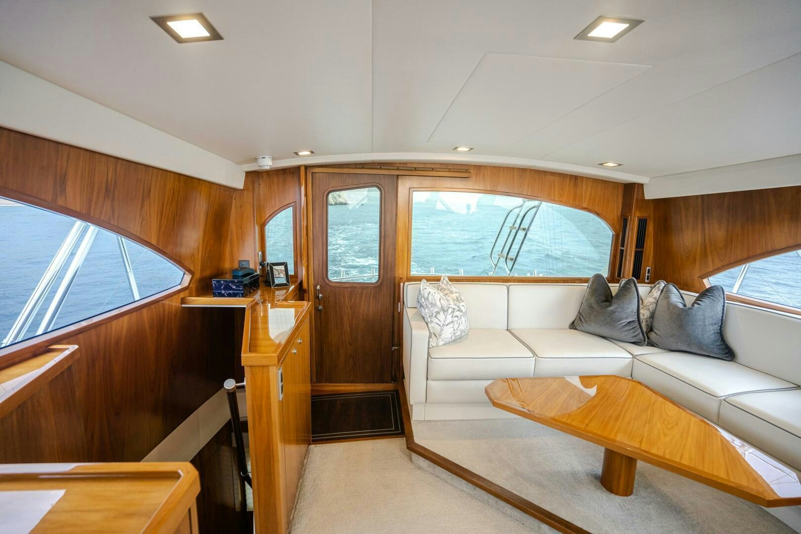 a room with a couch and a window aboard HOORAY Yacht for Sale